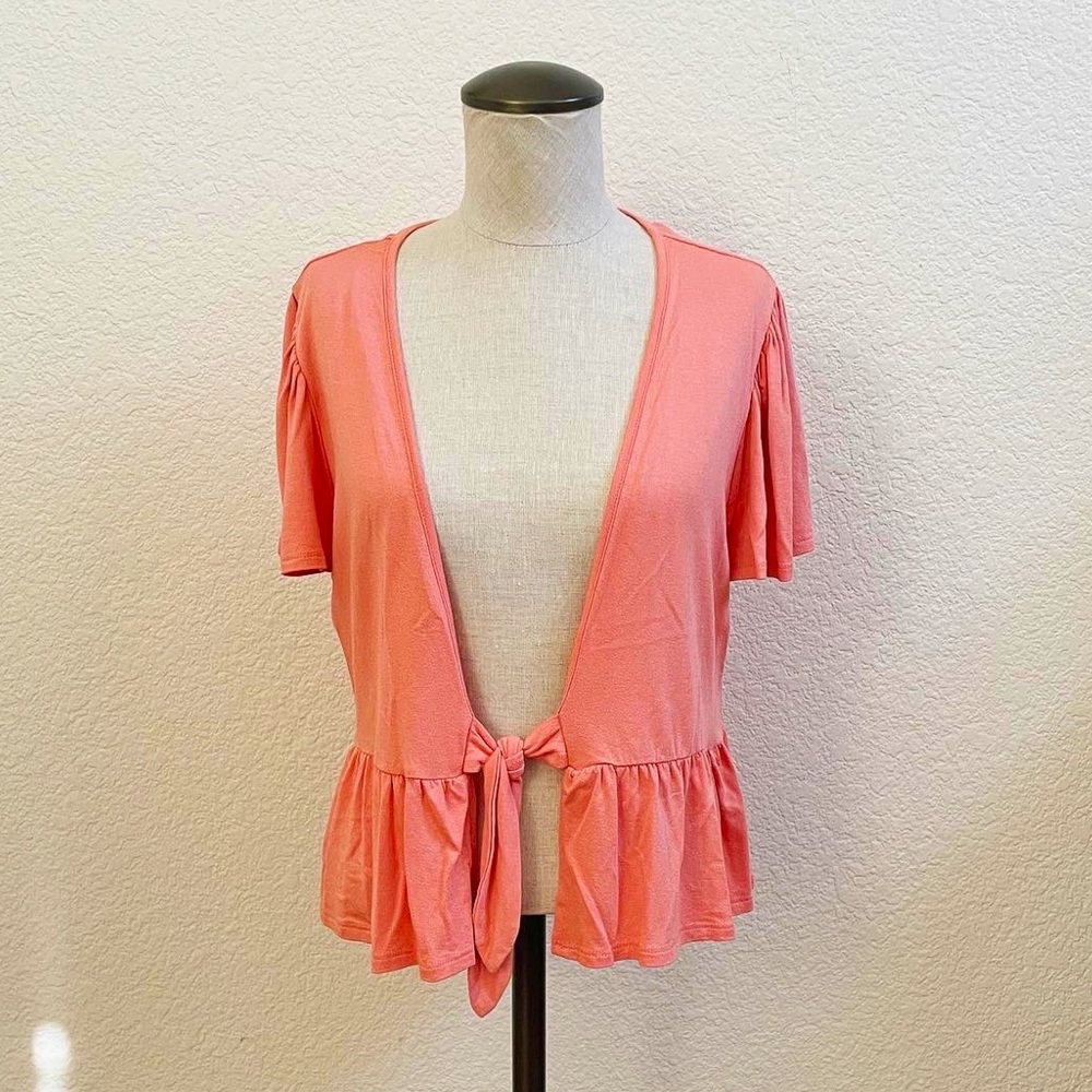 Peach tie front peplum top
